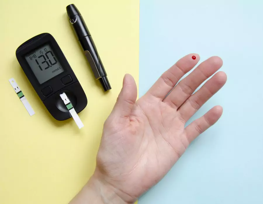 diabetes testing strips next to a glucose meter